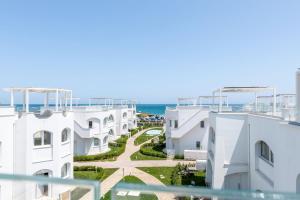 a view of the beach from the balcony of a building at Italian Experience - Brezza Costa Conero con Terrazza in Marcelli