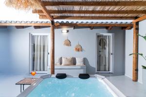 a pool in the middle of a room with a bed at Arbona Apartment IIΙ - View in Vóroi