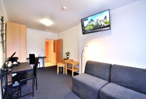TV a/nebo společenská místnost v ubytování Hotel Resort Luna