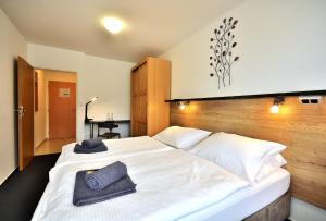 Postel nebo postele na pokoji v ubytování Hotel Resort Luna
