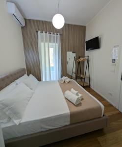 Postel nebo postele na pokoji v ubytování Lues Rooms