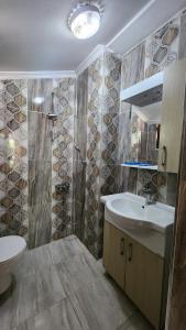 a bathroom with a sink and a shower at Trend Suite Hotel in Uzungöl +33 photos