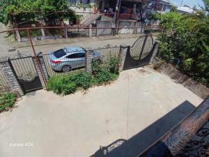 an aerial view of a car parked next to a fence at Private family house in Kobuleti +7 photos