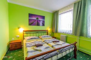 Postel nebo postele na pokoji v ubytování Hotel Hvězda