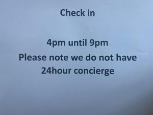 a sign that reads check in until please note we do not have at Hotel 50 in Bournemouth