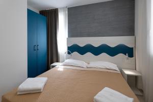 Postel nebo postele na pokoji v ubytování Residence Flow-R