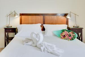 A bed or beds in a room at Kyriad Perpignan Sud