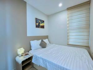 Postel nebo postele na pokoji v ubytování The Song Apartment 5 Stars Vung Tau - Căn Hộ The Sóng 5 Sao