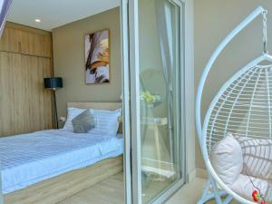 Postel nebo postele na pokoji v ubytování The Song Apartment 5 Stars Vung Tau - Căn Hộ The Sóng 5 Sao