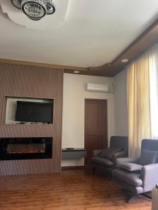 TV o dispositivi per l'intrattenimento presso Guest House Inn Side