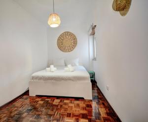 Katil atau katil-katil dalam bilik di Charming T3 with patio, beach and surf