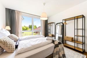 Ένα ή περισσότερα κρεβάτια σε δωμάτιο στο Edel&Liebe