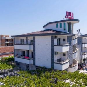 a building with a clock tower on top of it at Draga in Ulcinj
