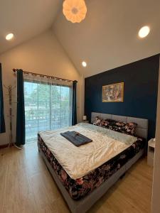 Postel nebo postele na pokoji v ubytování ลอยละล่อง รีสอร์ท Loy La Long Resort