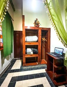 Rúm í herbergi á Riad Larache