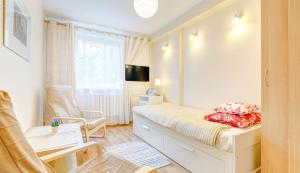 TV a/nebo společenská místnost v ubytování Apartament Brzeźno