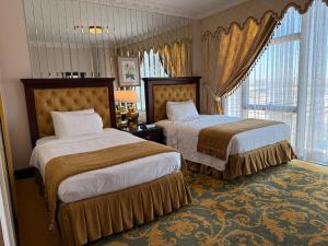 Postel nebo postele na pokoji v ubytování Habitat Hotel All Suites - Jeddah