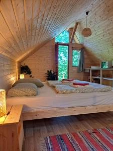 Postel nebo postele na pokoji v ubytování Kerca Bio Farm