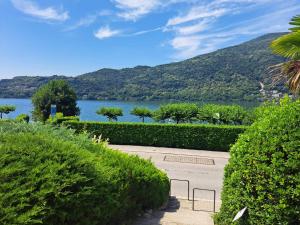 a walkway with a view of a body of water at Morcote Romance by Quokka 360 - flat with patio and communal pool in Morcote