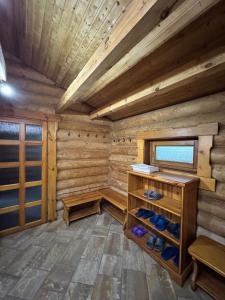 a room with a wooden room with shoes in it at Hotel Doi Haiduci in Orhei +50 photos