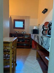 a kitchen with a counter top and a table at Zanzibar Huria in Bwejuu