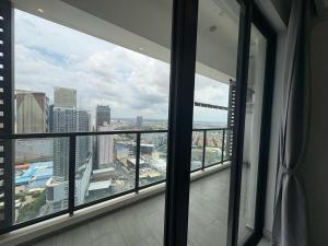 a room with a view of a city from a window at Prince HuanYu Center, 太子 寰宇中心 Multi-Apartment by Emma in Phnom Penh