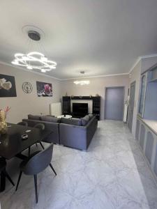a living room with a couch and a table at Apostolis Apartment in Vonitsa
