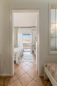 A bed or beds in a room at Hotel Aeollos