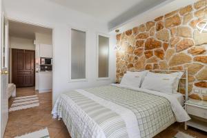 A bed or beds in a room at Hotel Aeollos