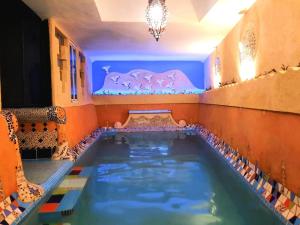 a indoor swimming pool in a room with a pool at DAR Dunia Panoramic terrace in Chefchaouen