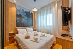 Voodi või voodid majutusasutuse Snowy woods Zlatibor toas