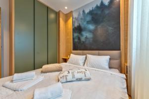 Voodi või voodid majutusasutuse Snowy woods Zlatibor toas