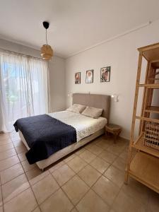 Postel nebo postele na pokoji v ubytování Nefeli Beach Home