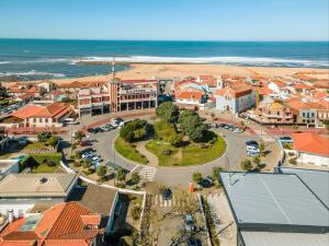 an aerial view of a town with a beach at Pena's Family Beach House in Arcozelo