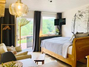 Postel nebo postele na pokoji v ubytování Tiny Ferienhaus 1 am Rimbach in Steinau an der Strasse