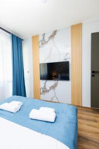 Postel nebo postele na pokoji v ubytování Boulevard Hotel