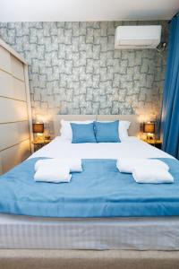 Postel nebo postele na pokoji v ubytování Boulevard Hotel