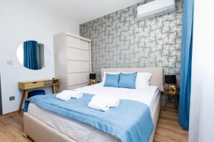 Postel nebo postele na pokoji v ubytování Boulevard Hotel