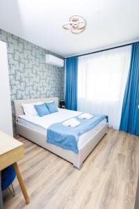 Postel nebo postele na pokoji v ubytování Boulevard Hotel