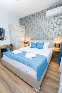 Postel nebo postele na pokoji v ubytování Boulevard Hotel