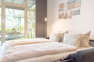 Postel nebo postele na pokoji v ubytování Ferienwohnung 54 Grad Nord App 8