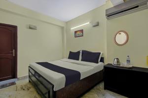Voodi või voodid majutusasutuse Hotel O Malhotra BnB toas