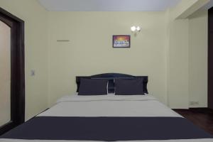 Voodi või voodid majutusasutuse Hotel O Malhotra BnB toas