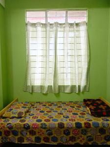 Postel nebo postele na pokoji v ubytování Meghalaya shillong dormitory