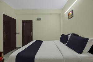 Voodi või voodid majutusasutuse Hotel O Malhotra BnB toas