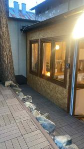 a building with rocks on the side of it at Solne Apartamenty Luna 4 in Wieliczka