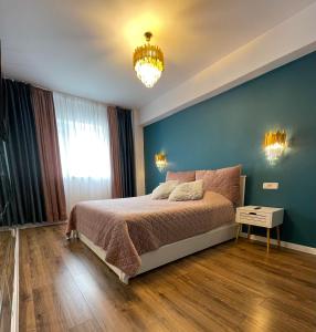 Postel nebo postele na pokoji v ubytování Marie Luxury Flat Coresi