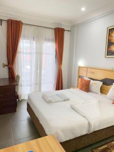 Postel nebo postele na pokoji v ubytování COFE Hotel Groupe