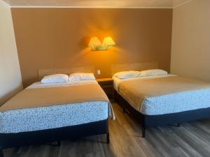 Postel nebo postele na pokoji v ubytování Le Campagnard