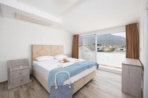 Postel nebo postele na pokoji v ubytování Orka World Villa 2 + 58 fotografií